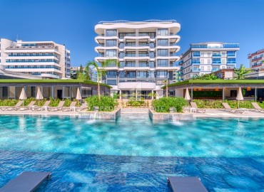 Меблированные апартаменты 1+1, 66,5м², с видом на море в элегантной резиденции на первой береговой линии в Каргыджаке, Алания ID-18033 фото-1
