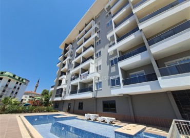 Двухкомнатная квартира, 50м², с видом на море, с чистовой отделкой в комфортабельной новостройке в районе Алании - Авсаллар ID-18036 фото-1