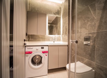 Фешенебельная трехкомнатная квартира, 95м², в элитной новостройке на первой береговой линии в Каргыджаке, Алания ID-18038 фото-9