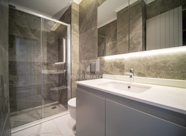 Фешенебельная трехкомнатная квартира, 95м², в элитной новостройке на первой береговой линии в Каргыджаке, Алания ID-18038 фото-10