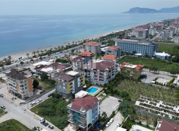 Видовы апартаменты с одной спальней, 55м², в комплексе с бассейном, в 50м от моря в Кестеле, Алания ID-18043 фото-1