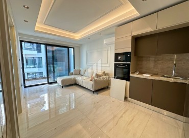 Элитная недвижимость на первой береговой линии в Махмутларе: квартира 1+1, 55м², в новостройке с отельной инфраструктурой ID-17272 фото-2