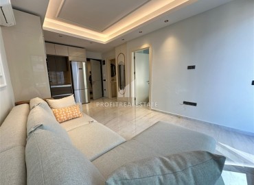 Элитная недвижимость на первой береговой линии в Махмутларе: квартира 1+1, 55м², в новостройке с отельной инфраструктурой ID-17272 фото-4