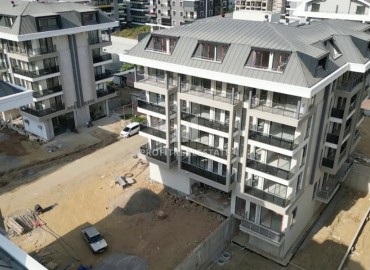 Апартаменты с двумя спальнями, 85м², в резиденции с бассейном с отличной локацией в 300м от моря в районе Каргыджак, Алания ID-18049 фото-1