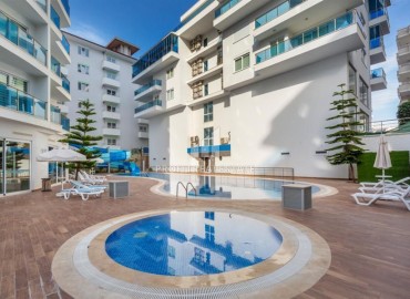 Меблированная квартира с двумя спальнями, 110м², в комплексе премиум класса в 300м от моря в Махмутларе, Алания ID-18057 фото-16