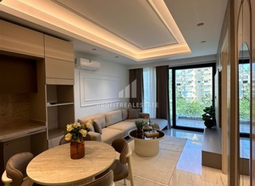 Элегантная двухкомнатная квартира, 55м², в фешенебельной резиденции на первой береговой линии в Махмутларе, Алания ID-18058 фото-2