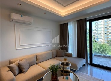 Элегантная двухкомнатная квартира, 55м², в фешенебельной резиденции на первой береговой линии в Махмутларе, Алания ID-18058 фото-3