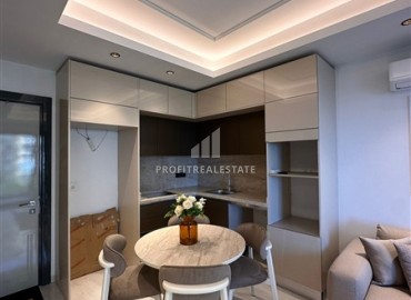 Элегантная двухкомнатная квартира, 55м², в фешенебельной резиденции на первой береговой линии в Махмутларе, Алания ID-18058 фото-7