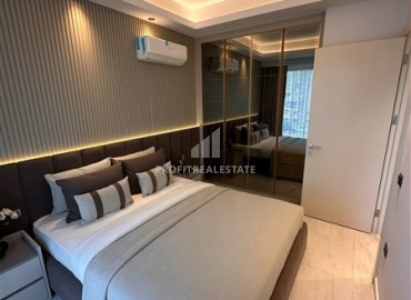 Элегантная двухкомнатная квартира, 55м², в фешенебельной резиденции на первой береговой линии в Махмутларе, Алания ID-18058 фото-9