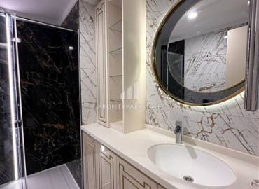 Элегантная двухкомнатная квартира, 55м², в фешенебельной резиденции на первой береговой линии в Махмутларе, Алания ID-18058 фото-10
