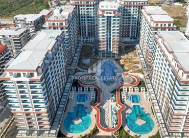 Двухкомнатная квартира 68м², на стадии строительства, в фешенебельном комплексе с богатой инфраструктурой, Махмутлар, Аланья ID-16944 фото-1