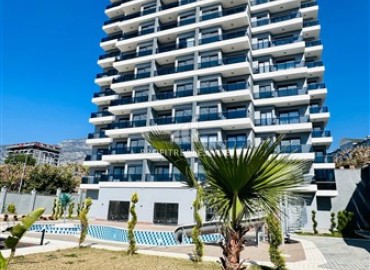 Новые двухкомнатные апартаменты, 55м², с чистовой отделкой в комплексе премиум класса в районе Махмутлар, Алания ID-18106 фото-1