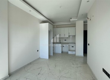 Новые двухкомнатные апартаменты, 55м², с чистовой отделкой в комплексе премиум класса в районе Махмутлар, Алания ID-18106 фото-2