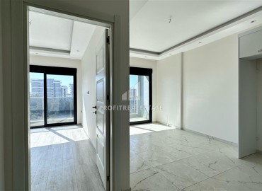 Новые двухкомнатные апартаменты, 55м², с чистовой отделкой в комплексе премиум класса в районе Махмутлар, Алания ID-18106 фото-5
