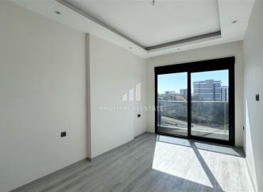 Новые двухкомнатные апартаменты, 55м², с чистовой отделкой в комплексе премиум класса в районе Махмутлар, Алания ID-18106 фото-6