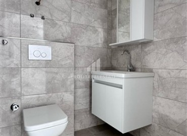 Новые двухкомнатные апартаменты, 55м², с чистовой отделкой в комплексе премиум класса в районе Махмутлар, Алания ID-18106 фото-7