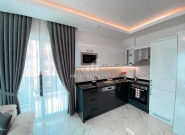 Уютная двухкомнатная квартира, 55м², в комплексе с хорошей инфраструктурой в 300м от моря в Авсалларе, Алания. ID-18107 фото-5