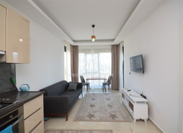 Укомплектованная квартира с одной спальней, 55м² с видом на горы в новом комплексе в Махмутларе, Алания ID-18120 фото-2