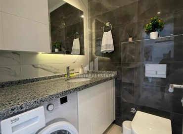 Элегантные двухкомнатные апартаменты, 50м² в комплексе с отельной инфраструктурой в Махмутларе, Алания ID-18134 фото-10