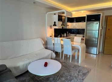 Меблированная квартира с одной спальней, 55м², в элитном комплексе у подножия Торосских гор в Махмутларе ID-18143 фото-2