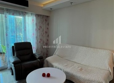 Меблированная квартира с одной спальней, 55м², в элитном комплексе у подножия Торосских гор в Махмутларе ID-18143 фото-4