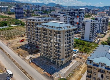 Апартаменты 1+1, 60м², с видом на горы в комфортабельной новостройке в центре Махмутлара, Алания ID-18146 фото-2