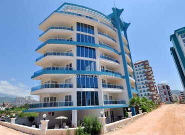 Уютные апартаменты 1+1, 65м², в резиденции с хорошей инфраструктурой в 450м от моря в Махмутларе, Алания ID-18151 фото-1