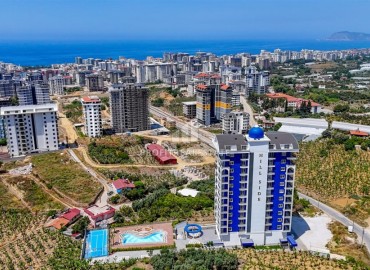Новые двухкомнатные апартаменты, 60м², в новостройке премиум класса в районе Махмутлар, Алания ID-18156 фото-1