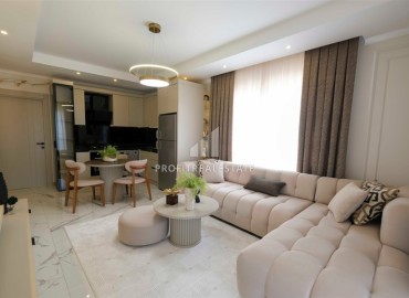 Новые двухкомнатные апартаменты, 60м², в новостройке премиум класса в районе Махмутлар, Алания ID-18156 фото-3