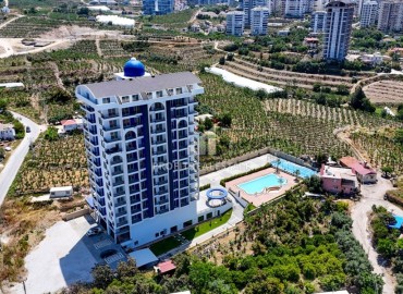Новые двухкомнатные апартаменты, 60м², в новостройке премиум класса в районе Махмутлар, Алания ID-18156 фото-17