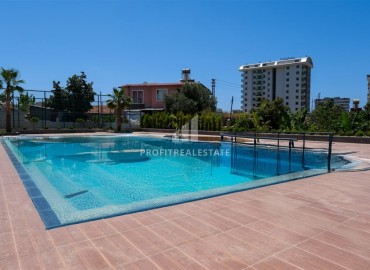 Новые двухкомнатные апартаменты, 60м², в новостройке премиум класса в районе Махмутлар, Алания ID-18156 фото-18