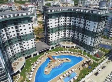 Уютная двухкомнатная квартира, 53м², на высоком этаже в элитном комплексе в 500м от моря в Махмутларе, Алания ID-18159 фото-1