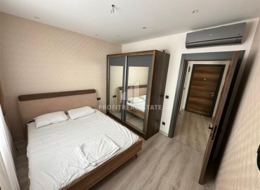 Уютная двухкомнатная квартира, 53м², на высоком этаже в элитном комплексе в 500м от моря в Махмутларе, Алания ID-18159 фото-6
