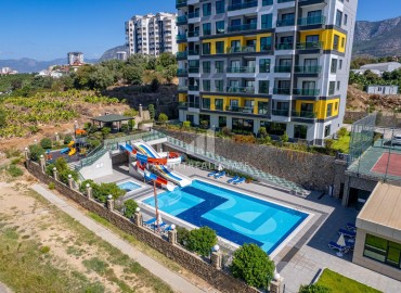 Элегантные двухкомнатные апартаменты, 50м² в комплексе с отельной инфраструктурой в Махмутларе, Алания ID-18134 фото-32
