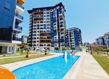 Комфортабельная двухкомнатная квартира, 60м², в комплексе с полной инфраструктурой, у моря в Махмутларе, Алания ID-18175 фото-1