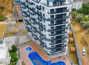 Двухкомнатная квартира, 62м², с чистовой отделкой в элитной новостройке в Авсалларе, Алания ID-18193 фото-1