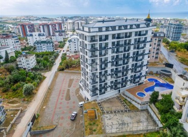 Двухкомнатная квартира, 62м², с чистовой отделкой в элитной новостройке в Авсалларе, Алания ID-18193 фото-12