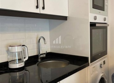 Двухкомнатные апартаменты со стильным интерьером, 55м², в новом комплексе с хорошей инфраструктурой в Махмутларе, Алания ID-18210 фото-5