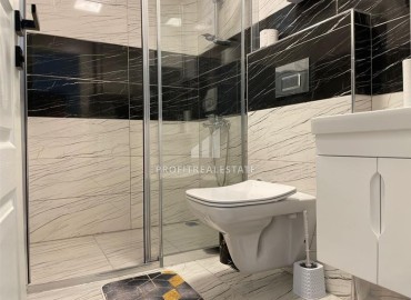 Двухкомнатные апартаменты со стильным интерьером, 55м², в новом комплексе с хорошей инфраструктурой в Махмутларе, Алания ID-18210 фото-10