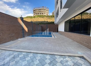 Двухкомнатные апартаменты со стильным интерьером, 55м², в новом комплексе с хорошей инфраструктурой в Махмутларе, Алания ID-18210 фото-15