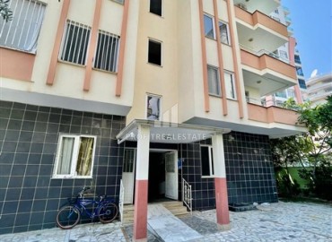 Бюджетная меблированная квартира с двумя спальнями, 80м², в 250м от моря, в недорогом доме в районе Махмутлар. Алания ID-18214 фото-1