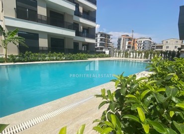 Двухкомнатная квартира, 55м², в новом комплексе с бассейном в Аксу, Алтынташ, Анталия по выгодной цене ID-18219 фото-1