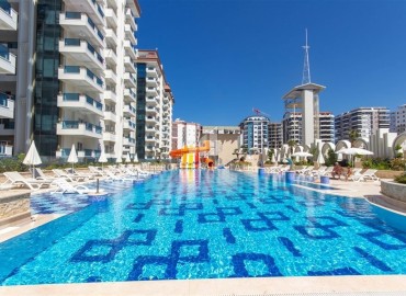 Меблированные двухкомнатные апартаменты, 69м², в новом элитном комплексе в 500м от моря в Махмутларе, Алания. ID-18228 фото-11