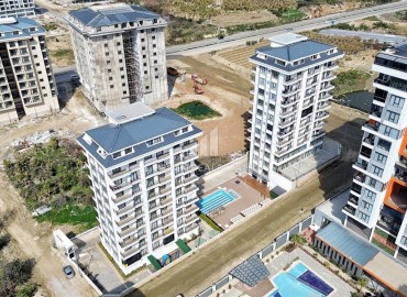 Стильная квартира с одной спальней, 50м², в новом комплексе премиум класса в центре Махмутлара, Алания ID-18262 фото-1