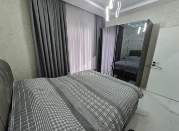 Стильная квартира с одной спальней, 50м², в новом комплексе премиум класса в центре Махмутлара, Алания ID-18262 фото-9