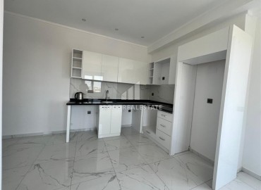 Новые апартаменты с одной спальней, 55м², в комфортабельном комплексе в районе Махмутлар, Алания, по привлекательной цене ID-18268 фото-2