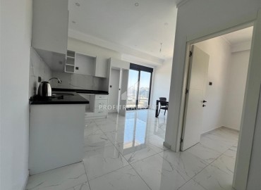 Новые апартаменты с одной спальней, 55м², в комфортабельном комплексе в районе Махмутлар, Алания, по привлекательной цене ID-18268 фото-3
