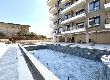 Двухкомнатные апартаменты, 45м², в новом малоквартирном комплексе с бассейном в районе Алании - Оба ID-18270 фото-2