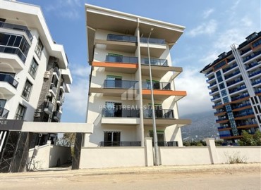 Двухкомнатная квартира, 45м², без мебели, в новостройке с бассейном в районе Махмутлар, Алания ID-18283 фото-1