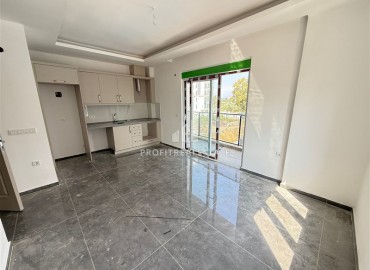 Двухкомнатная квартира, 45м², без мебели, в новостройке с бассейном в районе Махмутлар, Алания ID-18283 фото-3